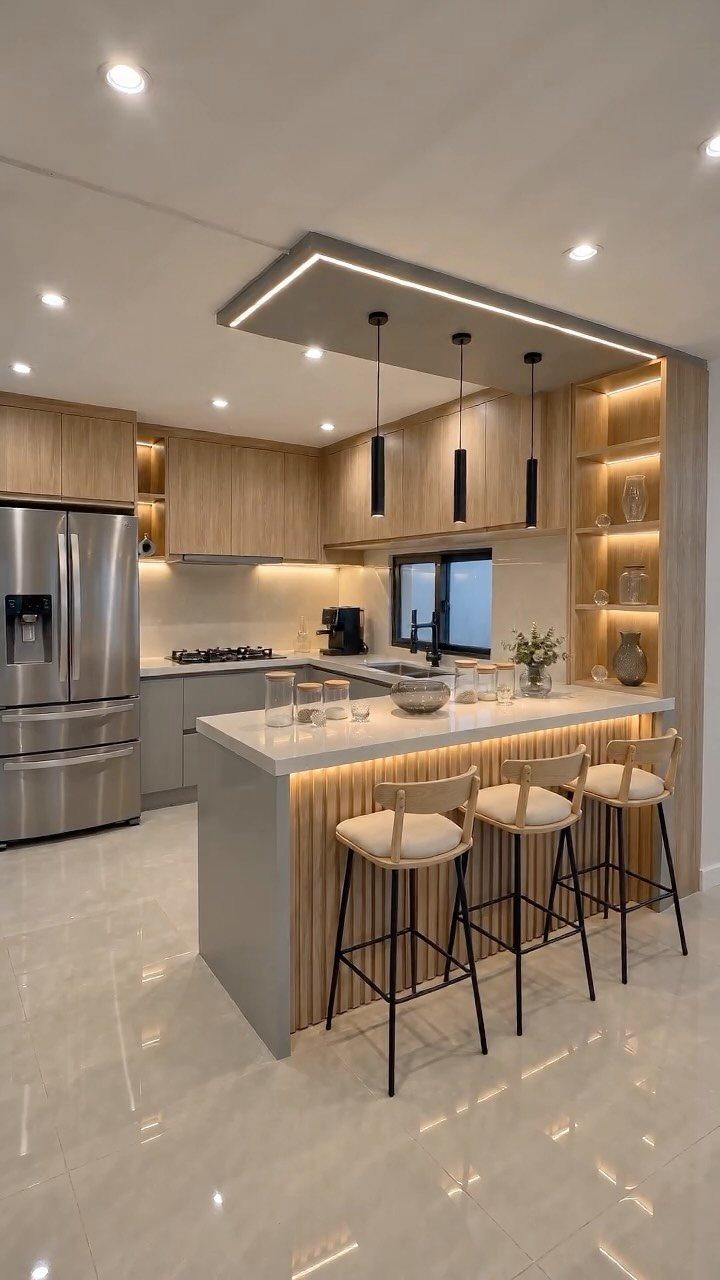 Modern kitchen island with white countertop, wooden slat side panel, and three bar stools.